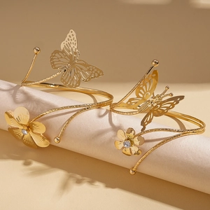 Elegant gold butterfly and flower arm bracelet set with sparkling crystals and metal finish