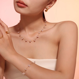 Bohemian jewelry set with pink natural stone necklace and bracelet on model