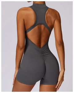 Detailed back view of dark gray yoga bodysuit featuring ruched butt lifting design