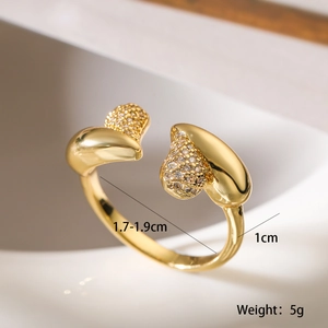 Detailed close-up of gold plated irregular zircon ring with dimensions and weight data