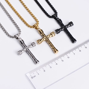 Macro detail of men's stainless steel cross necklace set with spiral textured design
