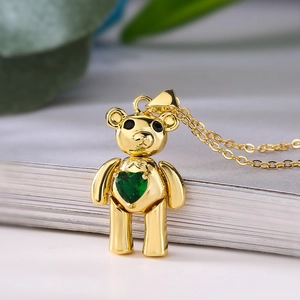 Gold bear necklace with green heart zircon pendant on a minimalist golden chain