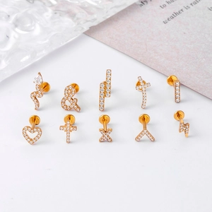 F136 titanium gold ear stud set with zircon heart, cross, and lightning bolt shapes