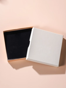 Square minimalist jewelry gift box with white lid and pale orange base for necklaces