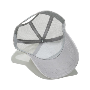 Detail view of the gray trucker hat's breathable mesh and adjustable snapback closure