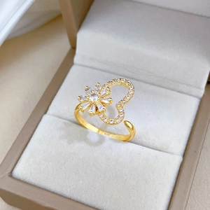 Rotating flower and heart adjustable gold ring with sparkling zircon in jewelry box