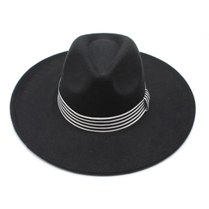 Top view of a black wide-brim fedora hat featuring a classic striped band and flat brim