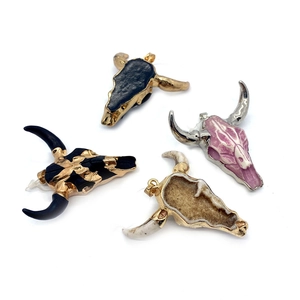 Four bull skull acrylic pendants in black blue pink and brown with metallic plating finish