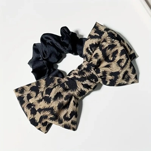 Leopard print bow scrunchie made of black silk satin fabric for high ponytail hair styling