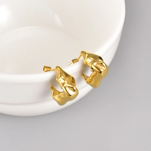 Minimalist golden irregular lava-textured fold earrings with metallic finish