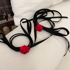 Elegant rose ribbon hair ties in red and black satin for ballet style aesthetics