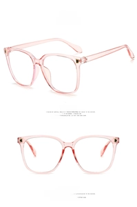 Detail view of transparent pink square glasses frames with decorative gold D metal accents