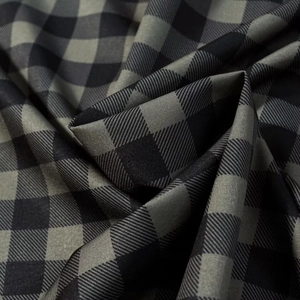 Detailed close-up showing the premium texture and weave of the classic plaid fabric shirt
