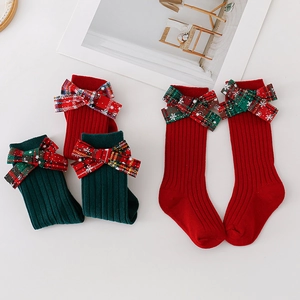Spanish style Christmas baby socks with snowflake bow ties in red and dark green colors
