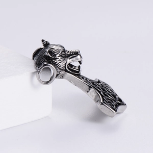 Detail of Thor's hammer pendant with Celtic knot patterns and a carved wolf head