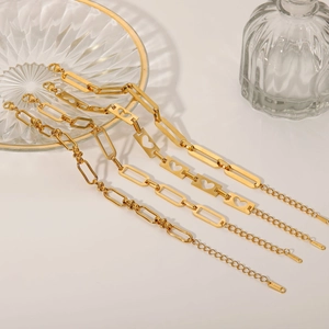 Detailed macro view of 18K gold plated stainless steel hollow heart and link chains