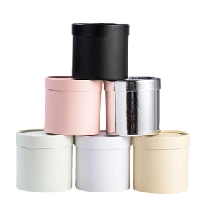 Mini round flower bucket gift boxes in various colors stacked for DIY floral arrangements