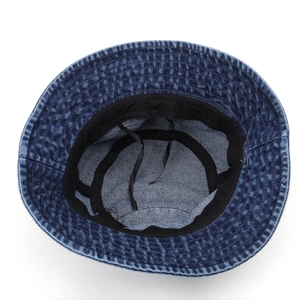 Deep blue denim bucket hat with internal adjustable drawstring and cotton texture