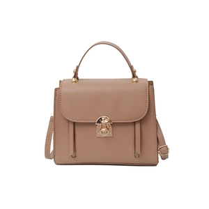Retro brown leather handbag for women featuring a metal lock and crossbody strap