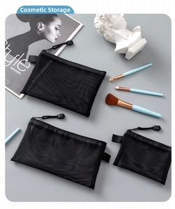 Three sizes of black mesh organizer bags shown with makeup brushes on grey background