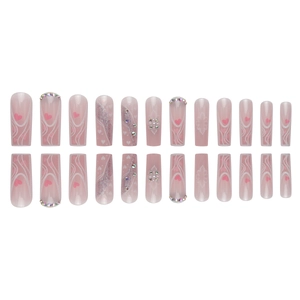 Pink gradient long coffin press-on nails with white swirls, hearts, and rhinestones