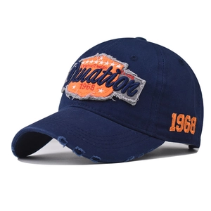 Vintage navy blue washed cotton baseball cap with orange embroidery and distressed brim