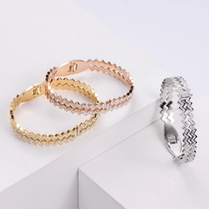 Three-piece set of zigzag wave bracelets with sparkling pavé crystals in tri-color finishes