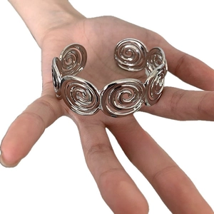 Silver spiral disk open cuff bracelet with geometric metal texture for women