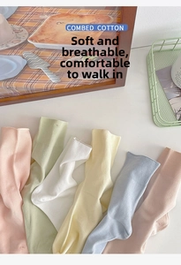 Detailed view of combed cotton ribbed socks in a variety of soft macaron colors