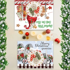 Christmas placemats with gingerbread house and gnome designs on a decorated festive table