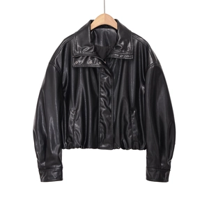 Detailed view of black faux leather aviator jacket featuring high collar and elastic hem