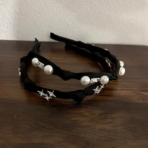 Elegant black knot headbands with white pearls and gold star charms for women hair styling