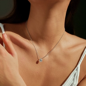 2-carat round brilliant moissanite S925 sterling silver necklace shown on model's neck