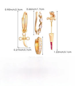 Detailed view of four-piece gold copper ear piercing set with red and white rhinestones