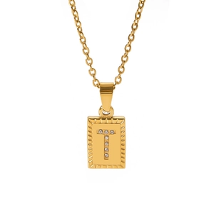 Detail of 18k gold square pendant featuring a crystal encrusted T letter on O-chain