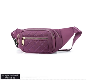 Detail of purple nylon waist bag with diamond quilted stitching and gold zipper hardware