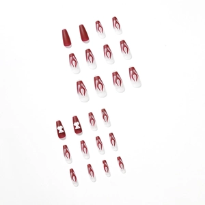 Press-on nails featuring dark red flame design and white 3D bow accents in a sweet-cool style