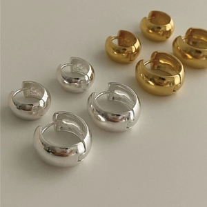 Polished silver and gold geometric hoop earrings in small and medium sizes