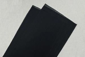 Detail shot of the elastic mesh fabric and black strap material of the bodycon dress