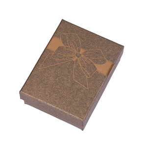 Deep brown rectangular jewelry gift box with elegant bow pattern from a 45-degree angle