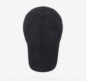 Top view of black breathable mesh baseball cap showing laser-cut holes and embroidered logo