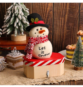 Detailed view of snowman Christmas candy box with felt texture and red scarf decoration