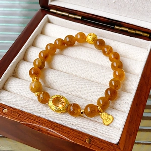 Gele kristallen kralenarmband met gouden kalebas hanger en verfijnde metalen kralen