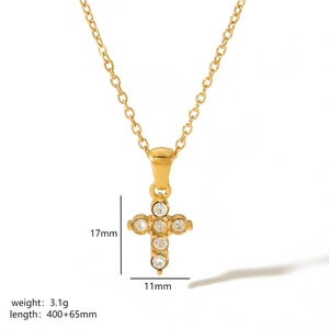 Detailed view of 18k gold cross pendant with dimensions and weight specifications
