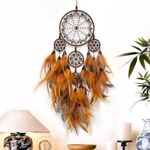 Handmade brown and orange five-ring dream catcher with feathers for wall decoration