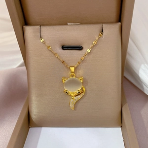 Titanium steel fox necklace with opal and diamonds in a beige jewelry box