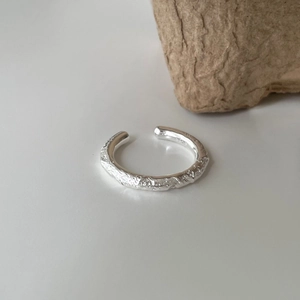 Minimalist 925 sterling silver open ring featuring a unique irregular textured surface