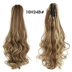 Detail view of long wavy claw clip ponytail extension in highlighted dark brown and blonde