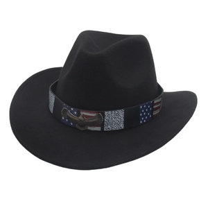 Detail of black felt cowboy hat with eagle metal badge and American flag pattern band