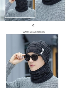 Detail of dark grey knitted beanie and neck warmer set with warm fleece lining for men